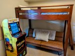 In the den bedroom, there is a twin size bed above a full-size futon and a separate full size bed